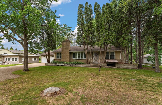 6379 Hodgson Rd, Lino Lakes, MN 55014 - single story home with a chimney, a front yard, and driveway