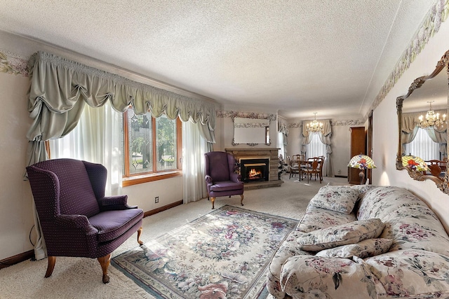 6379 Hodgson Rd, Lino Lakes, MN 55014 - carpeted living area with a chandelier, a textured ceiling, and a lit fireplace