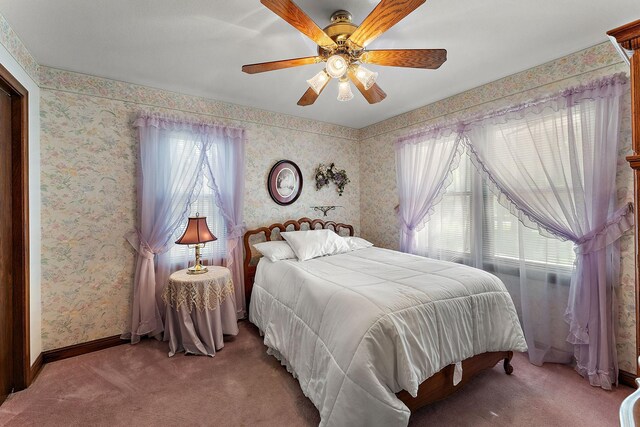 6379 Hodgson Rd, Lino Lakes, MN 55014 - carpeted bedroom featuring wallpapered walls and a ceiling fan