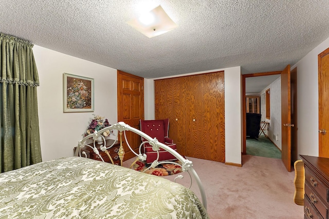 6379 Hodgson Rd, Lino Lakes, MN 55014 - bedroom with light carpet, a closet, and a textured ceiling
