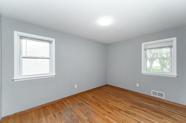 3568 6th St NW, Rochester, MN 55901 - unfurnished room featuring light wood finished floors and baseboards