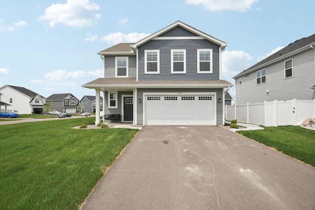 5173 Useppa Trl, Woodbury, MN 55129 - view of front of home with an attached garage and asphalt driveway