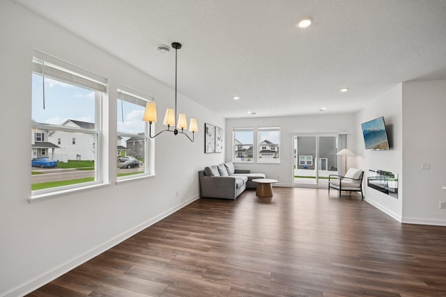 5173 Useppa Trl, Woodbury, MN 55129 - living room featuring dark wood-style floors, a chandelier, and recessed lighting