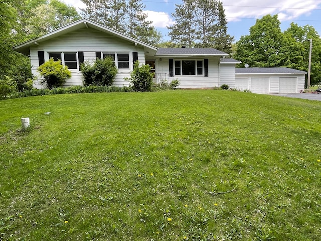 731 Woodland Loop, Fergus Falls, MN 56537 - ranch-style home with a detached garage and a front yard