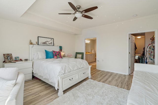 6600 Lyndale Ave S Unit 1005, Richfield, MN 55423 - bedroom with light wood finished floors, ornamental molding, ensuite bathroom, a ceiling fan, and a spacious closet