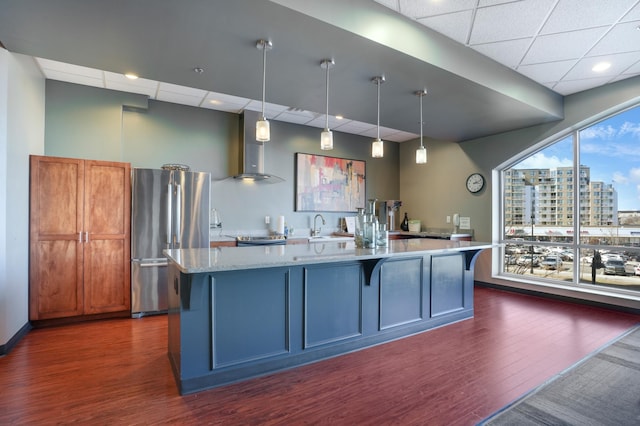 6600 Lyndale Ave S Unit 1005, Richfield, MN 55423 - kitchen featuring appliances with stainless steel finishes, wall chimney range hood, dark wood-style floors, a paneled ceiling, and a sink