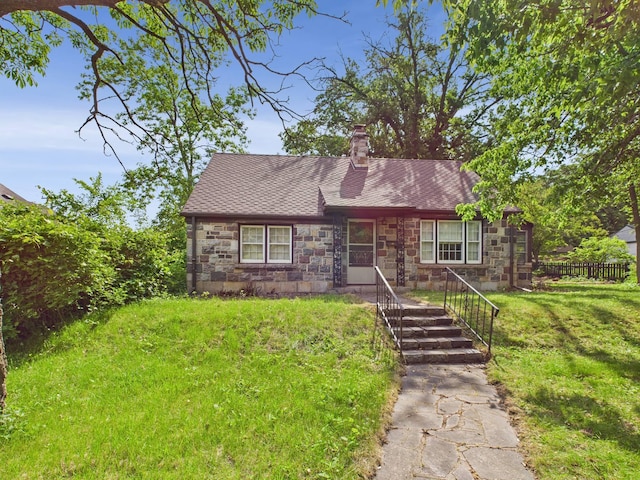 1538 8th Ave SE, Saint Cloud, MN 56304 - view of front of house with stone siding, a chimney, and a shingled roof