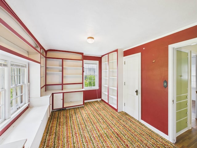 1538 8th Ave SE, Saint Cloud, MN 56304 - empty room featuring baseboards, carpet, and crown molding