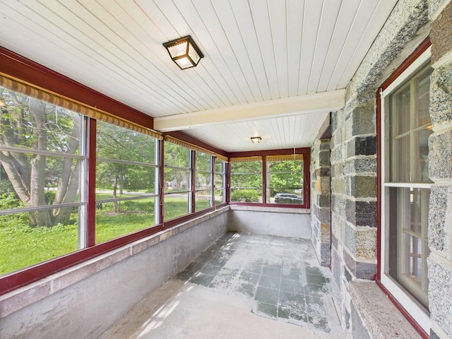1538 8th Ave SE, Saint Cloud, MN 56304 - unfurnished sunroom featuring beamed ceiling