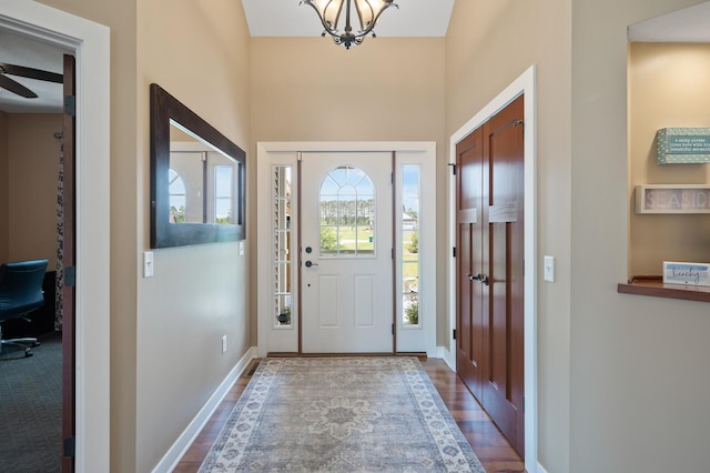 25455 145th St NW, Zimmerman, MN 55398 - entryway with a chandelier, dark wood finished floors, and baseboards