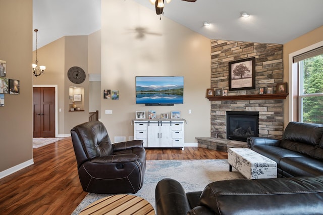 25455 145th St NW, Zimmerman, MN 55398 - living room with high vaulted ceiling, a ceiling fan, a chandelier, baseboards, and a fireplace