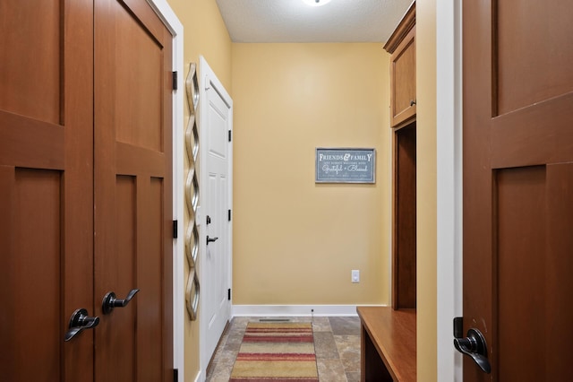 25455 145th St NW, Zimmerman, MN 55398 - entryway with baseboards and a textured ceiling