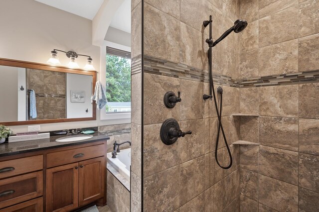 25455 145th St NW, Zimmerman, MN 55398 - bathroom featuring a tile shower, vanity, and a garden tub