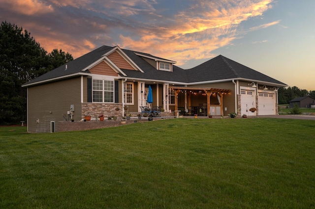 25455 145th St NW, Zimmerman, MN 55398 - view of front of property with a front lawn, an attached garage, driveway, and stone siding
