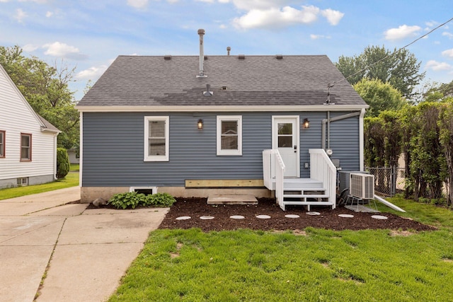 7417 Colfax Ave S, Richfield, MN 55423 - rear view of property featuring a yard, central AC, and a shingled roof