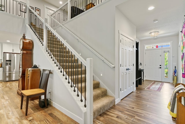 1884 Alexander Rd NE, Rochester, MN 55906 - foyer with stairway, light wood-style floors, baseboards, and recessed lighting