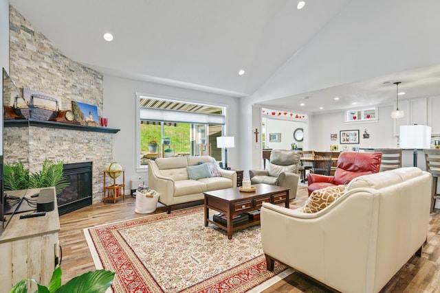 1884 Alexander Rd NE, Rochester, MN 55906 - living area with wood finished floors, recessed lighting, a fireplace, and high vaulted ceiling