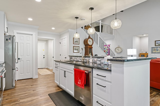 1884 Alexander Rd NE, Rochester, MN 55906 - kitchen featuring stainless steel appliances, white cabinets, light wood-type flooring, crown molding, and recessed lighting