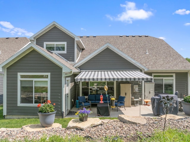 1884 Alexander Rd NE, Rochester, MN 55906 - rear view of property featuring a patio, a shingled roof, and outdoor lounge area