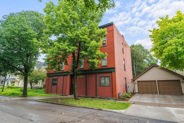 546 Laurel Ave Unit 6, Saint Paul, MN 55102 - view of front of property featuring a detached garage and brick siding