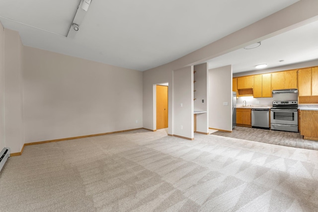 546 Laurel Ave Unit 6, Saint Paul, MN 55102 - unfurnished living room featuring light colored carpet, a sink, and baseboards