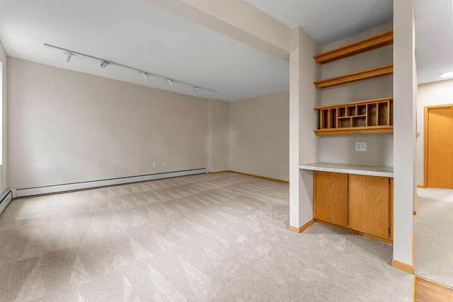 546 Laurel Ave Unit 6, Saint Paul, MN 55102 - unfurnished room featuring light carpet, baseboards, and track lighting