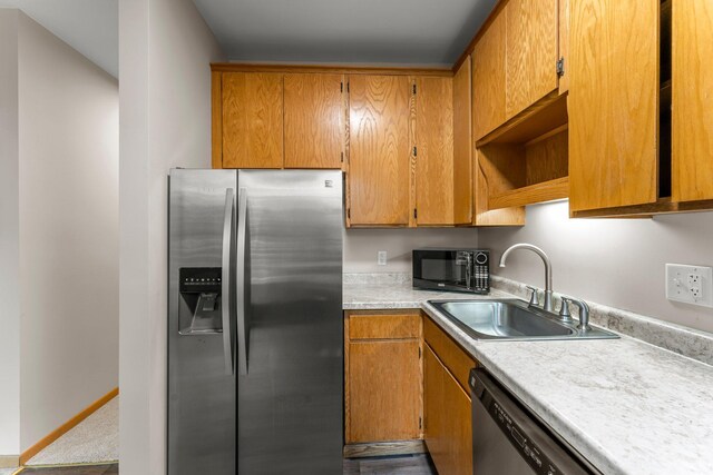 546 Laurel Ave Unit 6, Saint Paul, MN 55102 - kitchen with stainless steel appliances, a sink, light countertops, open shelves, and brown cabinetry