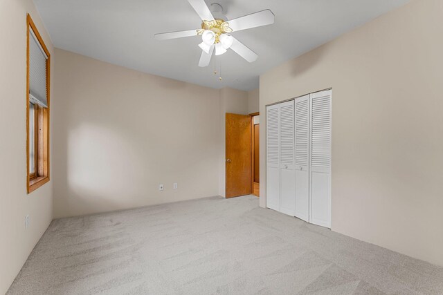 546 Laurel Ave Unit 6, Saint Paul, MN 55102 - unfurnished bedroom with carpet flooring, a closet, and a ceiling fan