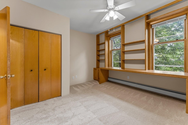 546 Laurel Ave Unit 6, Saint Paul, MN 55102 - unfurnished bedroom with a baseboard heating unit, light carpet, and a closet