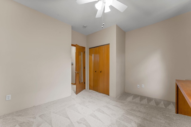 546 Laurel Ave Unit 6, Saint Paul, MN 55102 - unfurnished bedroom with carpet, a closet, and a ceiling fan