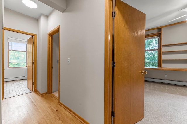 546 Laurel Ave Unit 6, Saint Paul, MN 55102 - hall with baseboard heating, plenty of natural light, and baseboards