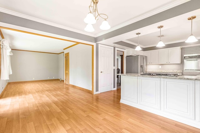 5313 Birchcrest Dr, Edina, MN 55436 - kitchen with stainless steel appliances, light wood-style floors, white cabinets, a chandelier, and baseboards
