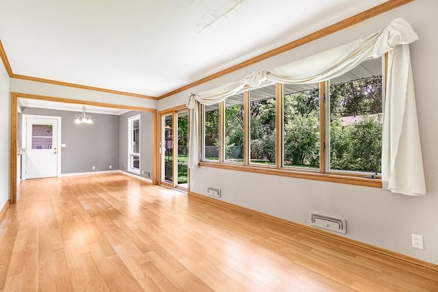 5313 Birchcrest Dr, Edina, MN 55436 - unfurnished room with a chandelier, light wood-style flooring, baseboards, and ornamental molding