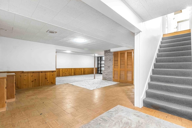5313 Birchcrest Dr, Edina, MN 55436 - finished below grade area featuring wainscoting, stairway, wooden walls, and baseboards