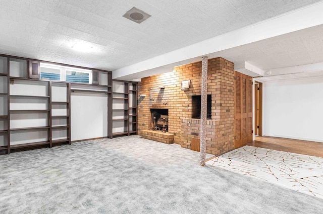 5313 Birchcrest Dr, Edina, MN 55436 - below grade area featuring a fireplace, carpet flooring, baseboards, and brick wall