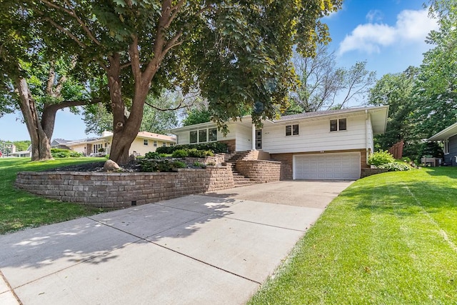 5313 Birchcrest Dr, Edina, MN 55436 - view of front of property with an attached garage, driveway, a front yard, and brick siding