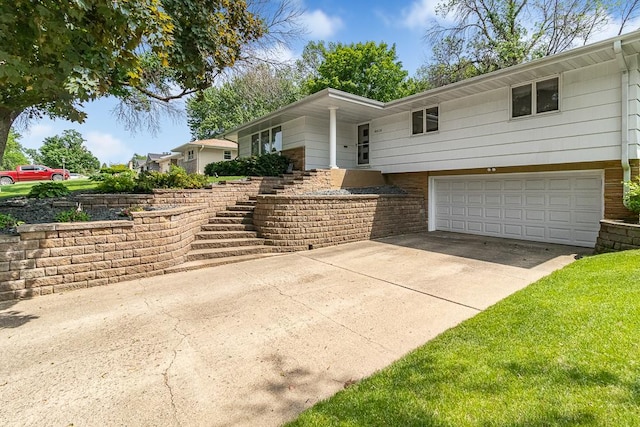 5313 Birchcrest Dr, Edina, MN 55436 - ranch-style home with an attached garage, stairway, driveway, and brick siding