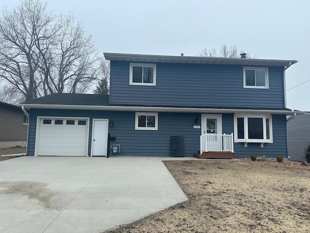 1911 Johnson St, Albert Lea, MN 56007 - traditional home featuring a garage and concrete driveway
