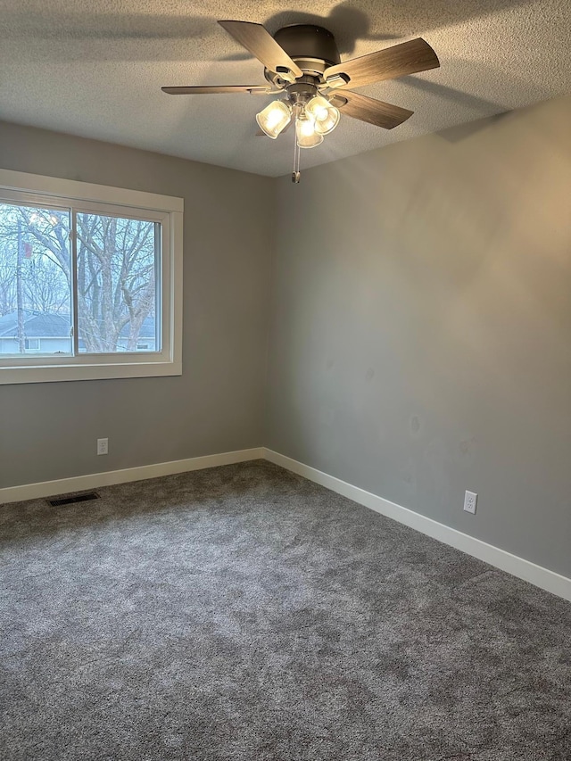 1911 Johnson St, Albert Lea, MN 56007 - unfurnished room featuring ceiling fan, carpet, a textured ceiling, and baseboards