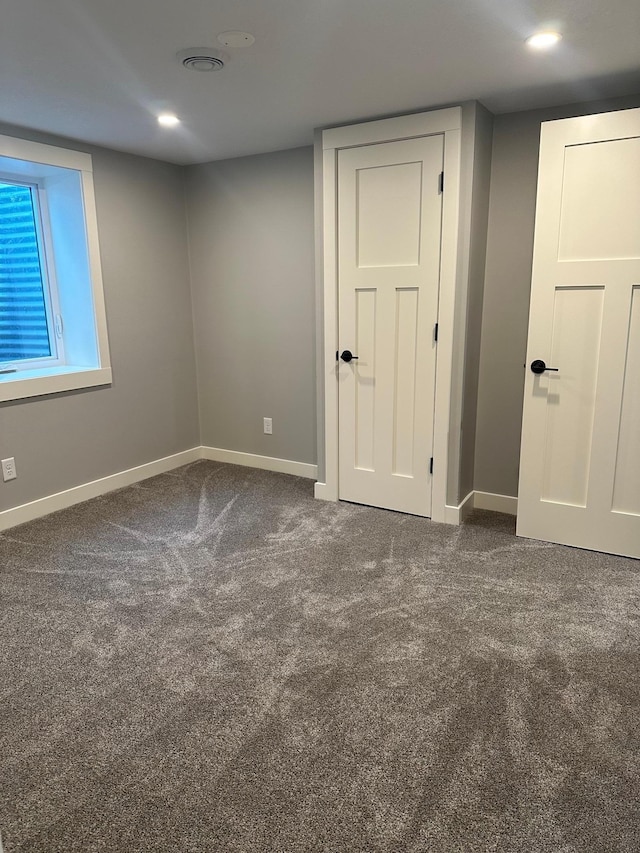 1911 Johnson St, Albert Lea, MN 56007 - unfurnished bedroom featuring baseboards, carpet flooring, and recessed lighting