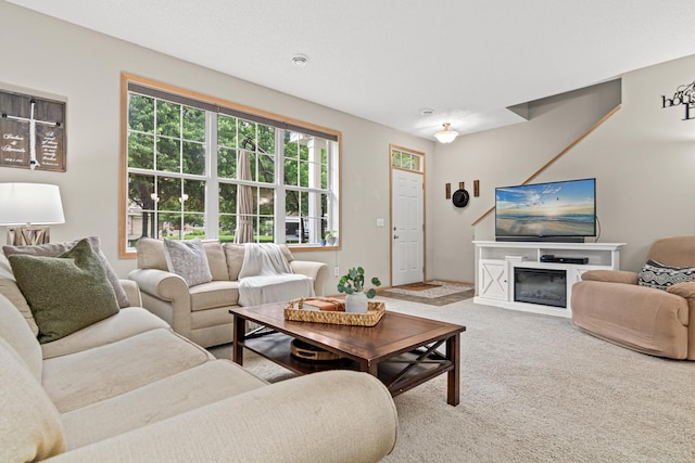 3537 Cherry Ln Unit C, Woodbury, MN 55129 - carpeted living room with a glass covered fireplace