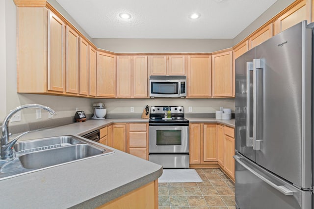 3537 Cherry Ln Unit C, Woodbury, MN 55129 - kitchen featuring stainless steel appliances, light brown cabinets, recessed lighting, a textured ceiling, and light countertops