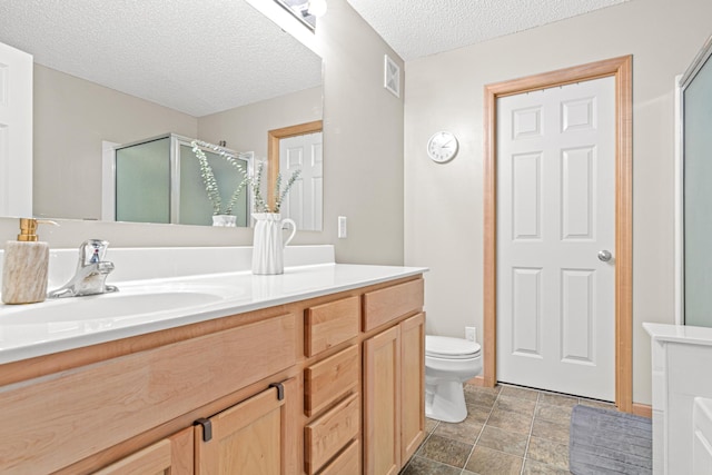 3537 Cherry Ln Unit C, Woodbury, MN 55129 - full bath with vanity, a shower stall, a textured ceiling, and stone finish flooring