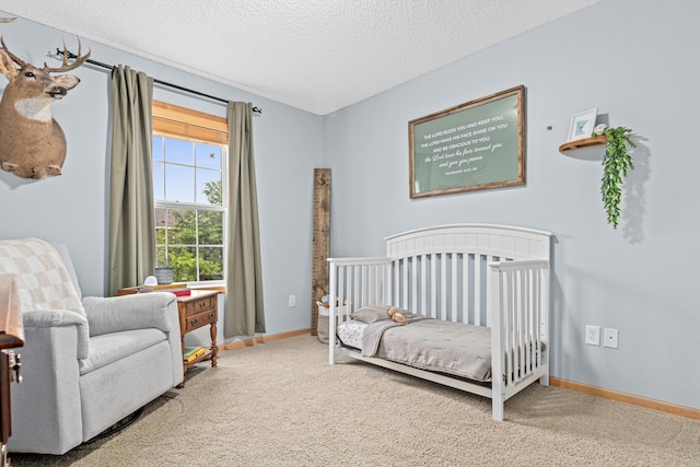 3537 Cherry Ln Unit C, Woodbury, MN 55129 - carpeted bedroom featuring a crib and a textured ceiling