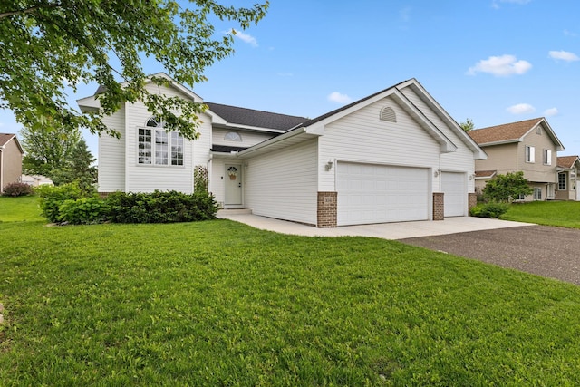 104 Bison Ct, Buffalo, MN 55313 - view of front of home with driveway, an attached garage, a front yard, and brick siding