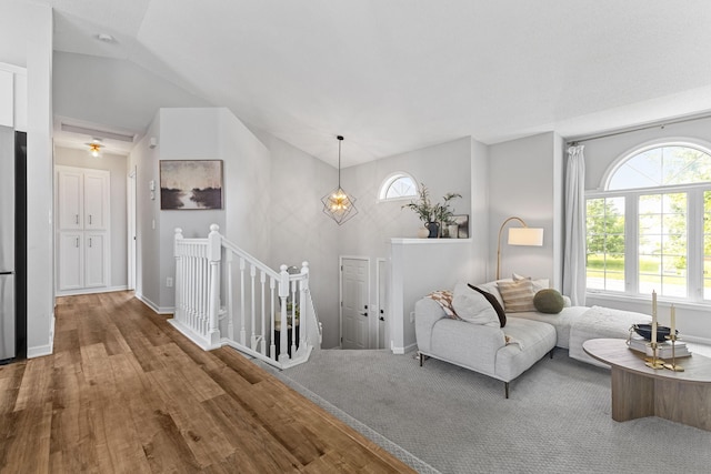 104 Bison Ct, Buffalo, MN 55313 - living area featuring vaulted ceiling and wood finished floors