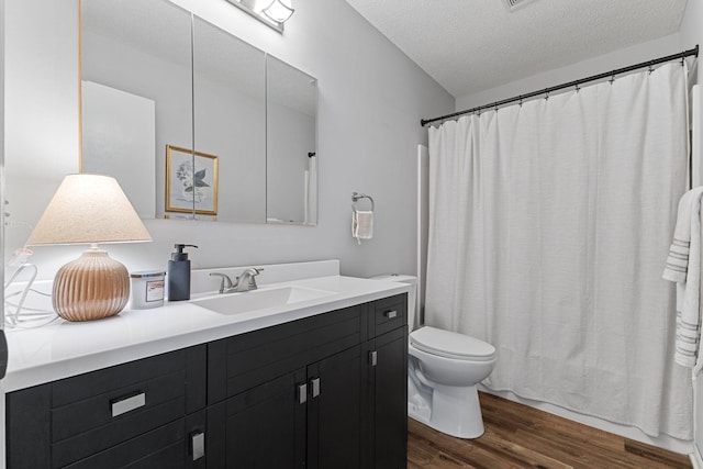 104 Bison Ct, Buffalo, MN 55313 - full bath featuring wood finished floors, vanity, a textured ceiling, and curtained shower