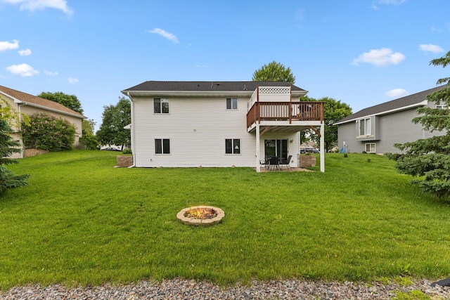104 Bison Ct, Buffalo, MN 55313 - back of property featuring an outdoor fire pit, a yard, a wooden deck, and a patio area