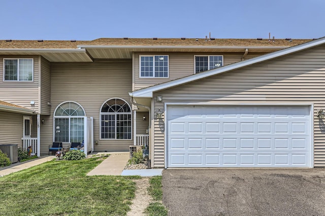 1127 Ridgestone Pl, Buffalo, MN 55313 - view of front facade featuring asphalt driveway, a front lawn, and a garage