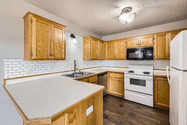 1127 Ridgestone Pl, Buffalo, MN 55313 - kitchen with white appliances, a peninsula, light countertops, a textured ceiling, and tasteful backsplash